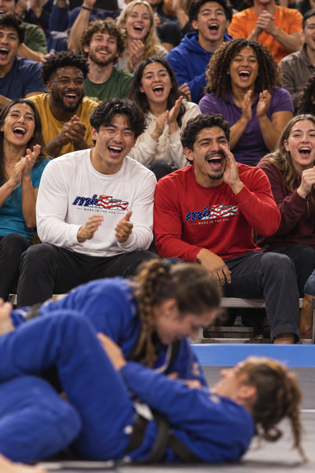 Fans wearing minTusa Star Spangled long-sleeve tees while cheering at a jiu-jitsu tournament