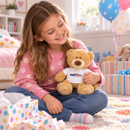 Child holding the minTusa Star Spangled teddy bear at a birthday celebration
