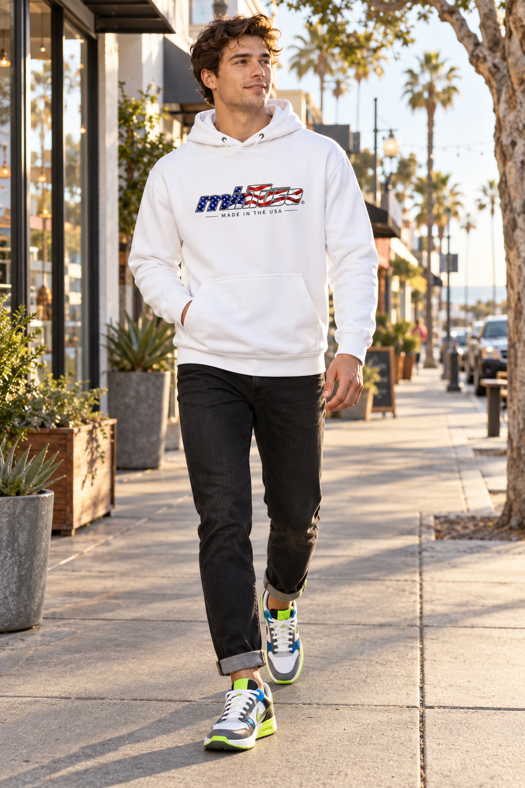 Man wearing the minTusa Star Spangled Unisex Hoodie on Main Street in El Segundo, California